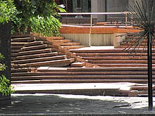 Earthquake damage to the square included cracking and displacement of paved areas, seen here in the brickwork terraces around the Town Hall. Steps in Victoria Square.jpg