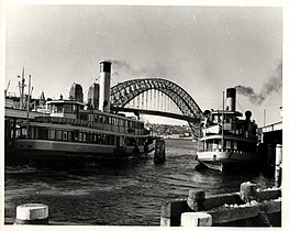 Kameruka (right) alongside the larger steel-hulled Kanangra in 1954 her last year as a steamer.