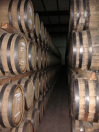 Tequila being rested or aged in oak barrels