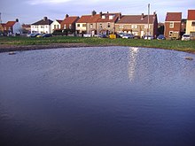 The Dew pond on Beeston Regis Common, reinstated in 2007