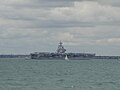 USS George H W Bush, seen anchored in the Solent, from Ryde, Isle of Wight.