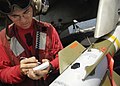 US Navy 060909-N-9742R-085 Aviation Ordnanceman 2nd Class Ryan Bauer, of Cedartown, Ga., verifies the serial numbers on components of a GBU-12 laser-guided bomb.jpg