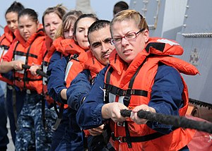 US Navy 120124-N-ZF681-212 Sailors assigned to the guided-missile destroyer USS Halsey (DDG 97) heave a line attached to a lifting band during a ma.jpg