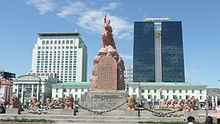 Mongolian script and Mongolian Cyrillic on Sukhbaatar's statue in Ulaanbaatar Ulan Bator 14.JPG
