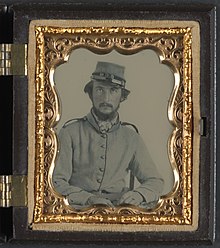 Unidentified soldier in Confederate uniform and Crescent City Guards of New Orleans kepi Unidentified soldier in Confederate uniform and Crescent City Guards of New Orleans kepi LCCN2012646155.jpg