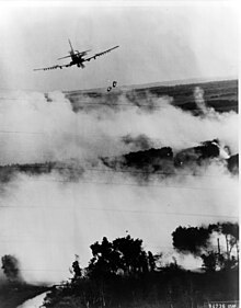 A RVNAF A-1E Skyraider drops two napalm bombs on a Viet Cong hideout near Cần Thơ, South Vietnam, circa 1967.