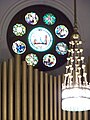 Interior, organ pipes, chandelier.