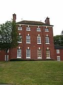 Mansion Court, a large Georgian house, now an apartment block, was originally Heath House, built by the Foley family from the profits of water power on the Wom. Wombourne Mansion Court.JPG