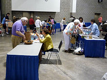 Before people enter the main appraisal/recording area, general appraisers quickly categorize and give tickets to specific appraisers (e.g. "Asian Art", "Metal Work", etc.). 2009-0711-AntiquesRoadshow05.jpg