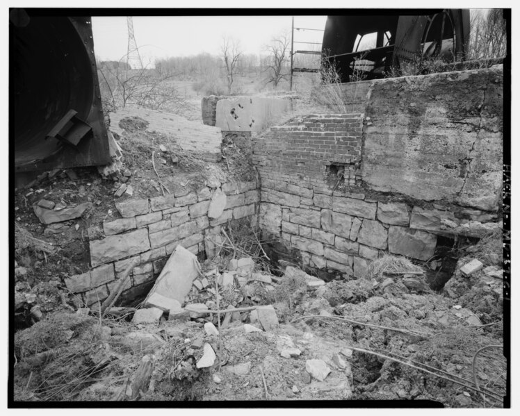 File:AIR-MANWAY SHAFT WALL AND FAN HOUSE FOUNDATION WALL FROM NORTHWEST. AEROVANE FAN AT UPPER LEFT, SCAFFOLD AND LEPLEY VENTILATOR AT UPPER RIGHT. - Consolidation Coal Company Mine HAER MD,1-MLOTH.V,1C-1.tif