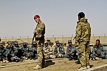 British military policeman attached to the 1st Battalion, the Princess of Wales Royal Regiment, teaches Afghan Border Police trainees patrol tactics at the Lashkar Gah Training Center in Lashkar Gah, Helmand province, Afghanistan, March 13, 2012. Afghan Border Police class at Lashkar Gah Training Center 120313-A-YI377-037.jpg