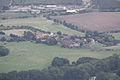 Čeština: Bílý Újezd (obec Velemín) v pohledu z Milešovky. České středohoří, Česká republika. English: Bílý Újezd village (Velemín municipality) as seen from Milešovka Hill, České středohoří, Czech Republic.