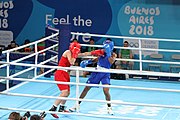 Deutsch: Boxen bei den Olympischen Jugendspielen 2018 Tag 12, 18. Oktober 2018 - Finale Leichtgewicht Mädchen – Junioren-Weltmeisterin und dreifache Juniorinnen-Europameisterin Caroline Sara DuBois (Großbritannien, blau) schlägt Juniorinnen-Asienmeisterin Porntip Buapa (Thailand, rot). English: Boxing at the 2018 Summer Youth Olympics on 18 October 2018 – Girls' lightweight Gold Medal Bout – Caroline Sara DuBois (Grat Britain, blue) wins over Porntip Buapa (Thailand, red). Español: Boxeo en los Juegos Olímpicos Juveniles de Verano de 2018 en 18 de octubre de 2018 - Combate de medalla de oro de peso ligero para niñas - Caroline Sara DuBois (Gran Bretaña, azul ) gana sobre Porntip Buapa (Tailandia, rojo).