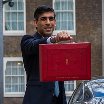 Sunak holding up a red box containing the 2020 budget speech Budget Speech 2020 (cropped 1x1).png