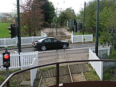 Car crosses the tramway level crossing at Colyford - geograph.org.uk - 1285286.jpg
