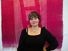 Clare Nicholls, weaver, in front of 'Ghost Ladder', Wayne Art Center, 2021