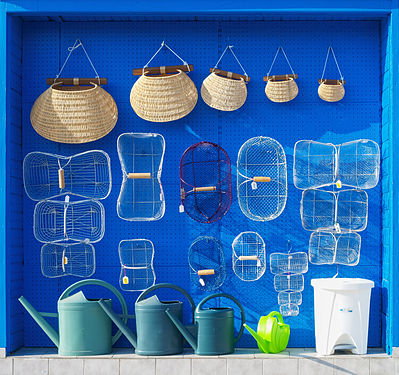 Fish baskets in an ironmongers' shop front in Charente-Maritime, France.