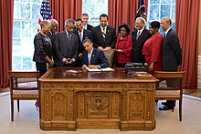 Sharpton watches as President Barack Obama signs an executive order on July 26, 2012 Educational Excellence for African Americans Executive Order Signing.jpg