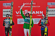 Simon Ammann (left), Roman Koudelka (middle) and Michael Hayböck (right) at the FIS Ski Jumping World Cup 2014 in Engelberg podium ceremony (21 December 2014)