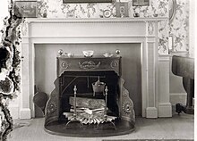 An installed Franklin stove within a fireplace Franklin Stove.jpg