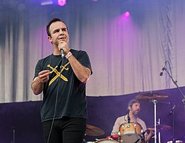 Frontman Sam Herring in 2015 at the Kosmonaut Festival, Germany, wearing a Double Dagger T-shirt