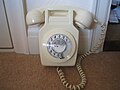 711 Wall mounted Ivory Telephone, strangely photographed sitting on the floor.