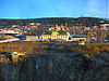 The mining museum (yellow building), near the edge of the Great Pit. Central Falun is in the background.