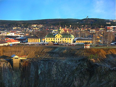 The mining museum (yellow building), near the edge of the Great Pit. Central Falun is in the background.