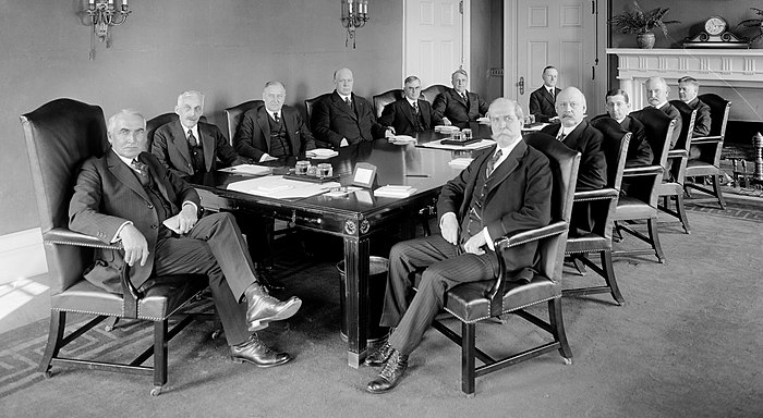 Harding and his first Cabinet, 1921From left: Harding, Andrew W. Mellon, Harry M. Daugherty, Edwin Denby, Henry C. Wallace, James J. Davis, Charles Evans Hughes, Calvin Coolidge, John W. Weeks, Will H. Hays, Albert Fall, Herbert Hoover