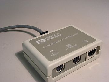HP HIL Adapter, which allows standard PC keyboards and mice to be added to an HIL host. Note the pass-through port on the right, which allowed other HIL devices to be daisy-chained through this one.