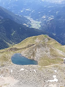 Blick hinunter zum I Lagh da Mürüsciola und das Puschlav im Hintergrund.