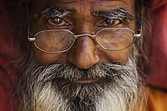 India bearded man portrait with reading glasses