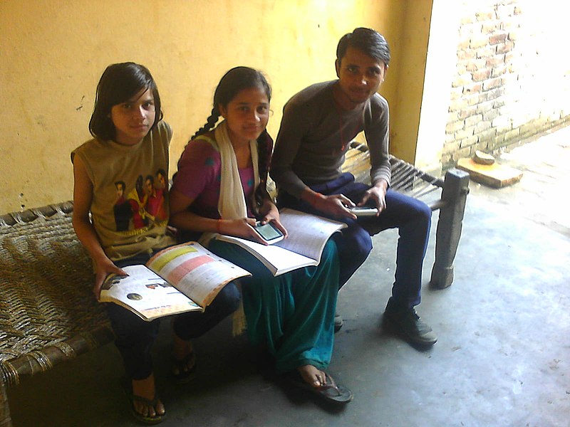 File:India group of students using WikiReader.jpg