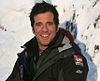 actor in ski-jacket, with snow in the background