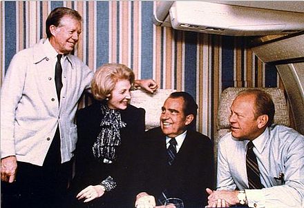 Annenberg with former Presidents Nixon, Ford, and Carter during a flight to the funeral of Anwar Sadat, October 1981