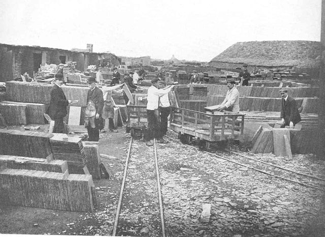 Quarries which had their own rail link to a port had a great advantage. Here the finished slates are being loaded into slate waggons at the Penrhyn Qu