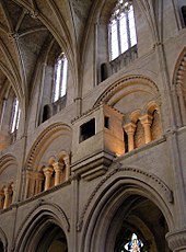 Malmesbury Abbey, Wiltshire, England. The nave wall is divided into three stages: the upper stage with windows is the clerestory, beneath it is the triforium, and the lowest stage is the arcade. Malmesbury.abbey.clerestory.arp.jpg