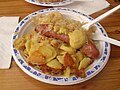 German Mettwurst (sausage) with fried potatoes and sauerkraut