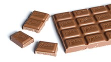 Milk chocolate tablet Milka Alpine Milk Chocolate bar 100g with chunks broken off.jpg