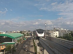 MRT Pink Line skytrain runs above Ram Inthra road in the Min Buri area