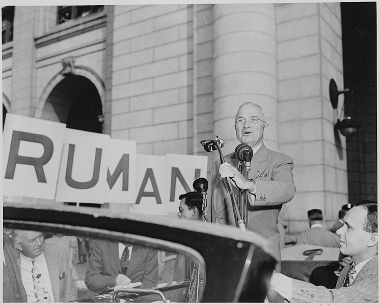 File:President Harry S. Truman standing in an open car, speaking into microphones, Washington, DC. President Truman had... - NARA - 199965.jpg