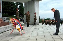 Russian president Vladimir Putin visiting the monument in 2000 President Putin laying a wreath at a monument to the liberating Soviet Army in Pyongyang.jpg