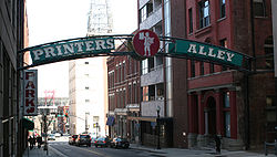 A large sign marks the entrance to Printer's Alley on Church Street. Printers alley.jpg