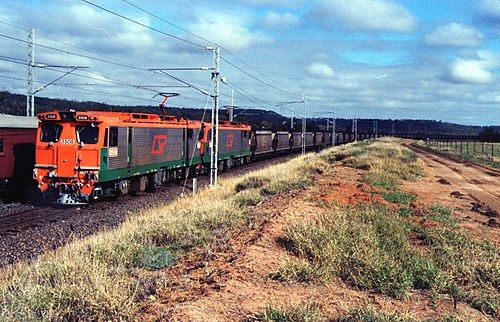 QR electric loco 3508 and another haul an eastbound coal train on the Blackwater line ~1993.jpg