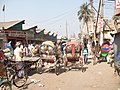 Rickshaws in old Dhaka market (8474631817).jpg