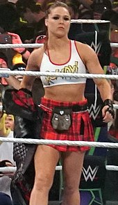 Ronda Rousey won the 2022 women's Royal Rumble match and chose to challenge Charlotte Flair for the SmackDown Women's Championship at WrestleMania 38. Ronda Rousey at WM34 (cropped).jpg