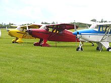 A fly-in of Short Wing Piper aircraft from an Aircraft type club. The aircraft are (l-r) a Piper PA-17 Vagabond, a Piper PA-16 Clipper and a Piper PA-22-150 Tri-Pacer ShortWingPiperLine-up02.jpg