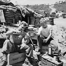 Two Australian Army soldiers enjoy some recreation time at a sandbagged Navy, Army and Air Force Institutes (NAAFI), Korea, 1952 SoldiersRecreationNAAFI.jpg