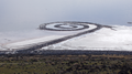 Robert Smithson's Spiral Jetty (1970) on the Great Salt Lake in Utah. With black basalt and earth from the site, he made a design 1,500 feet long and 15 feet wide.