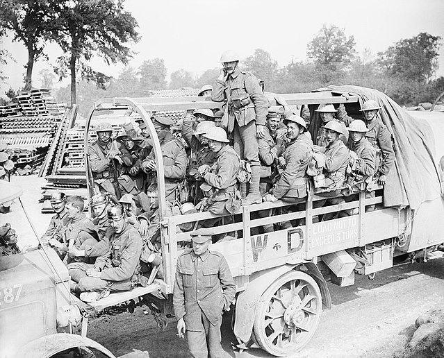 Men of the 16th (Irish) Division (possibly of the 47th Brigade) in a lorry going back for a rest after taking Guillemont, 3 September 1916. They are p